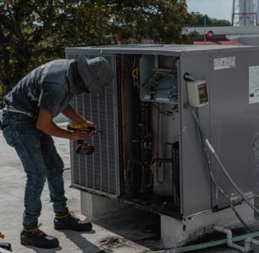 An HVAC technician provides seasonal maintenance.